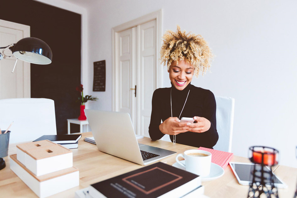 Woman working and checking phone Man working in studio checking phone